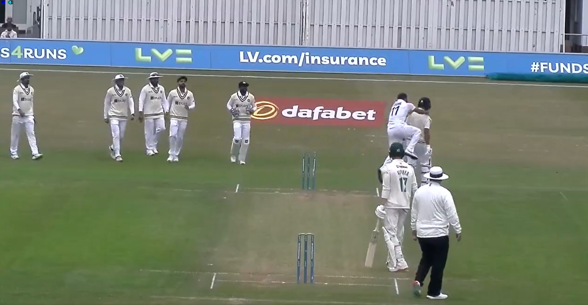  Mohammed Shami jumps on Cheteshwar Pujara after cleaning him up in India's warm-up match.
