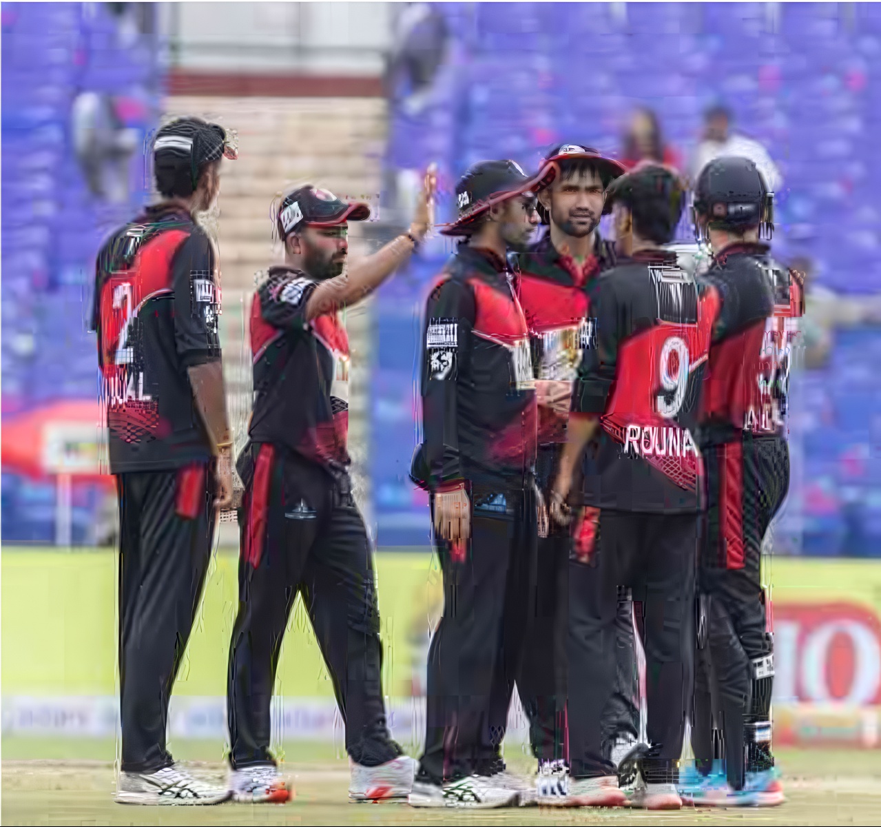 East Delhi Riders' spinner Rounak Waghela with his teammates 