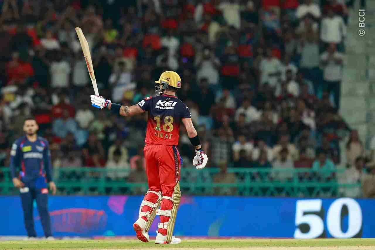 Virat Kohli waves his bat after reaching his fifty during the LSG vs RCB macth in Lucknow.